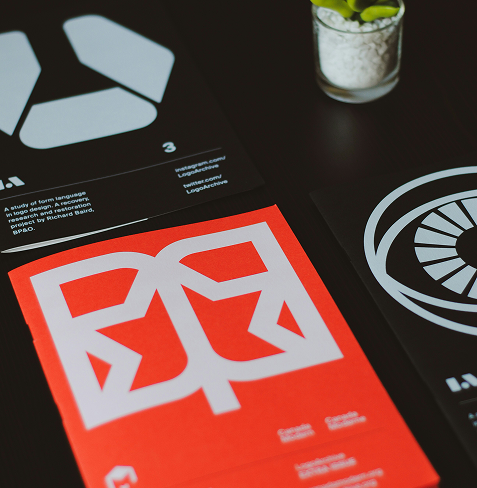 Featured Photo, Red Logo Design on Black Background